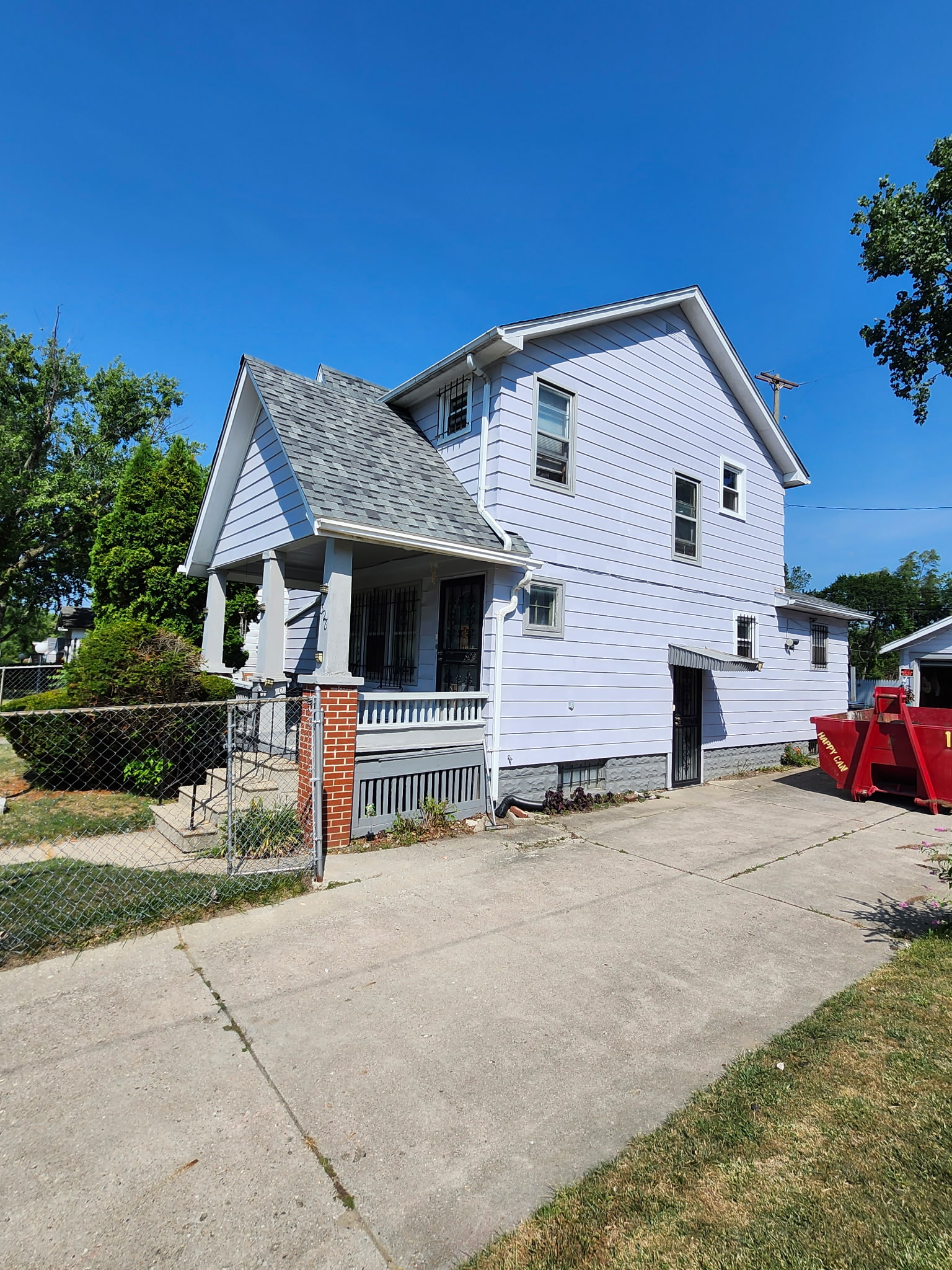 Exterior renovation showing roofing and siding